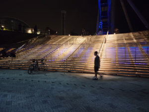 Matthew walking in front of the Ferris wheel